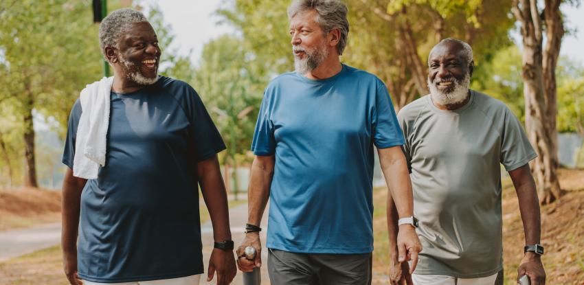 Three men walking outside